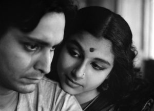 Aparna (Sharmila Tagore) and Apu (Soumitra Chatterjee) in Calcutta. Apur Sansar (The World of Apu). The final film of The Apu Trilogy