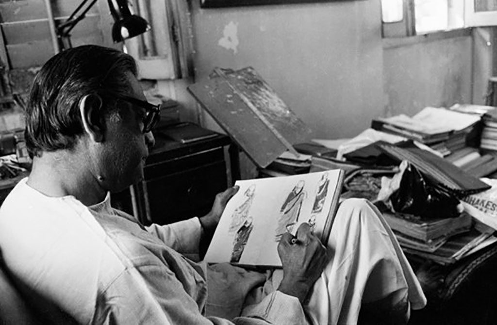 Satyajit Ray sketching costumes possibly for home and the world 1984 ©Nemai Ghosh