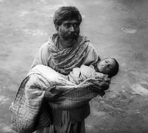 A villager brings a dying child for Devi's blessings