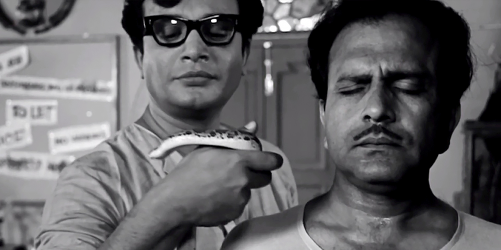 Byomkesh Bakshi (Uttam Kumar) with his snake